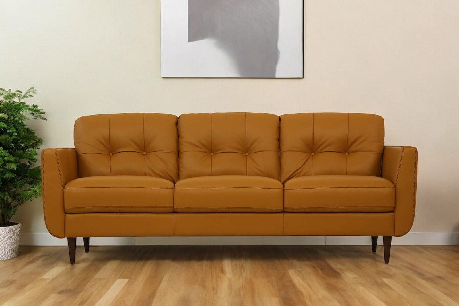 The Longhorn – Orange Leather Sofa with Black Legs
