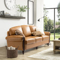 Dietmar Genuine Leather Sofa – Camel Curved Leather Nailhead Sofa